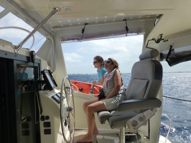  girls helping out with sail setting