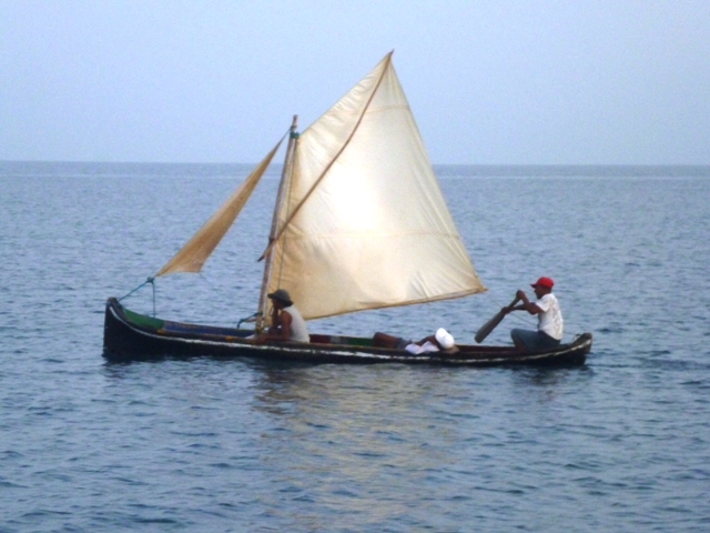 Fishermen heading home in their sailboat